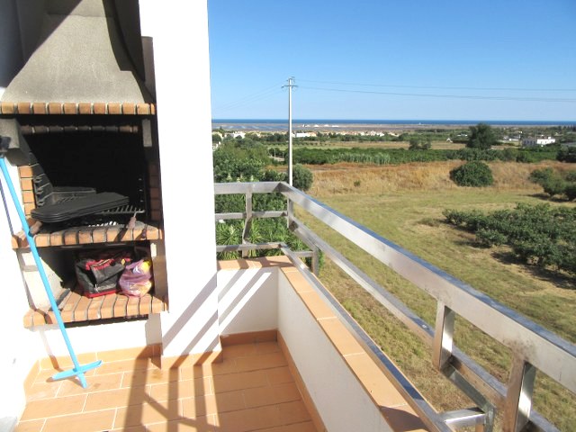Balcony next to kitchen with fitted BBQ