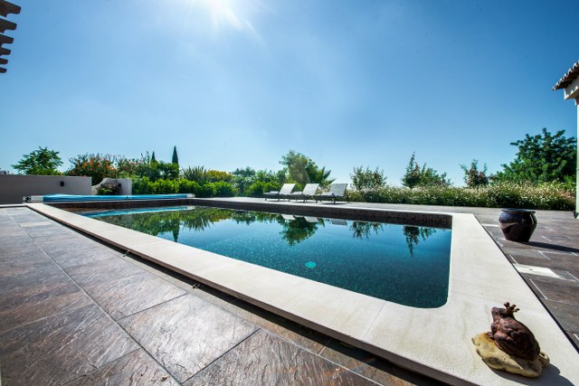 Large south facing swimming pool and sun terraces