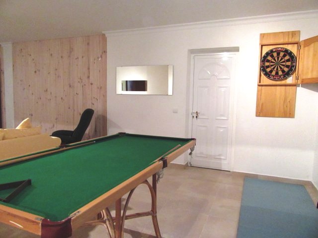Games room with seating area, flat panel TV, DVD player, books and board games, darts and mini biljart