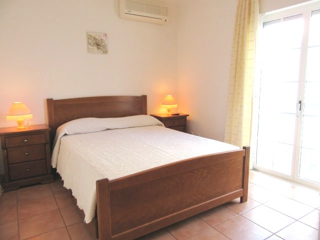 Spacious double bedroom with air conditioning and built in wardrobes