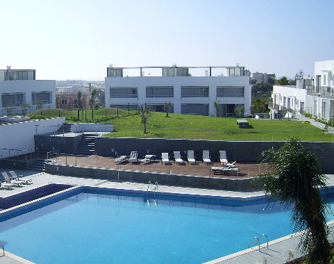 View of swimming pool & sun terrace of Terracos de Tavira