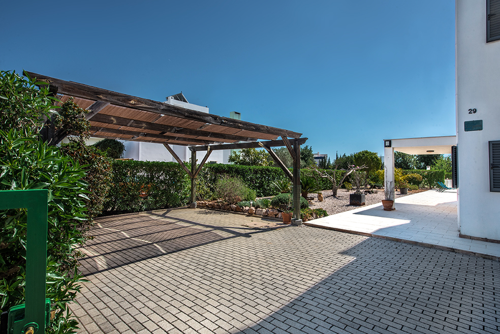 Ample off-street parking, two parking spacing underneath pergola